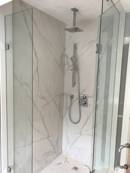 Finished glass shower enclosure