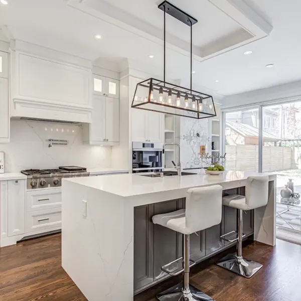 Completed kitchen — island seating and cabinetry