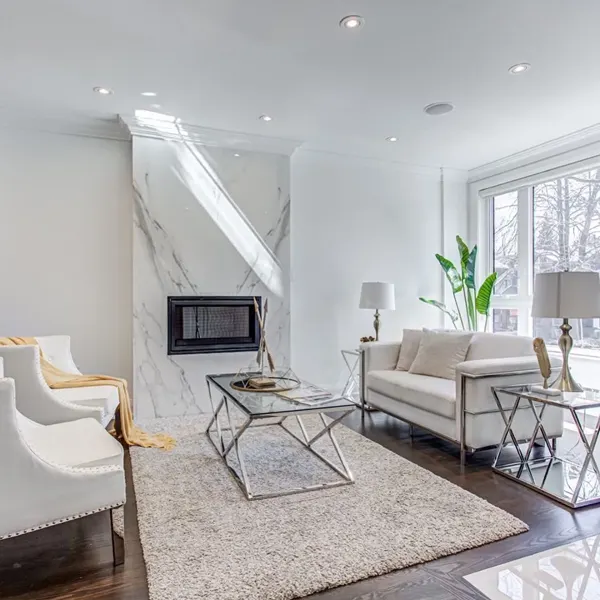 Completed living room — seating beside the stone fireplace