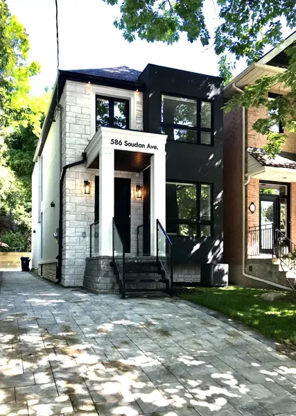 Completed front exterior — view toward the entrance