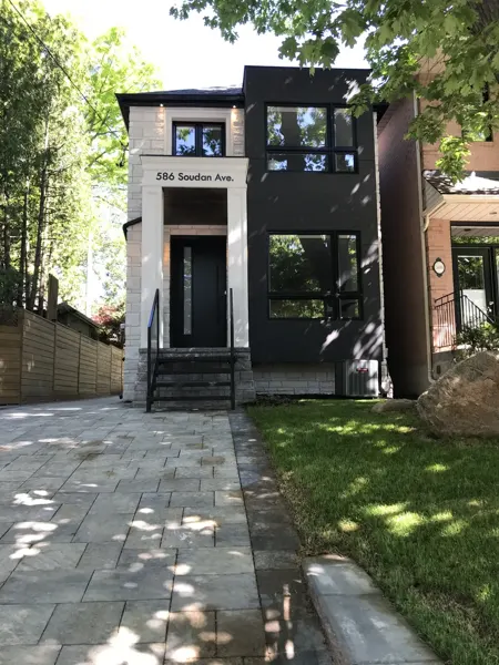 Completed front exterior — front elevation in summer