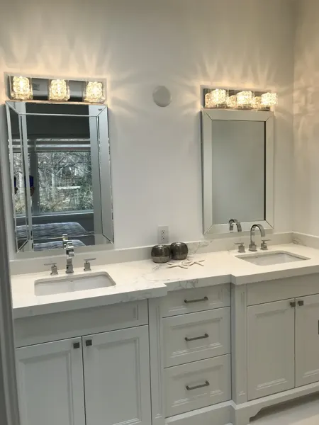 Completed bathroom — double vanity and mirrors