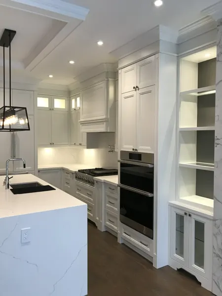 Completed kitchen — appliance wall and fireplace shelving