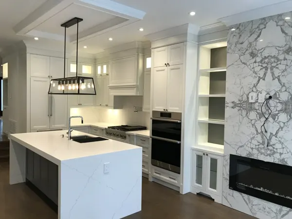 Completed kitchen — island with illuminated cabinetry