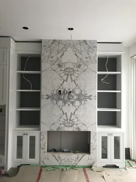 Kitchen fireplace — shelving and stone surround being fitted