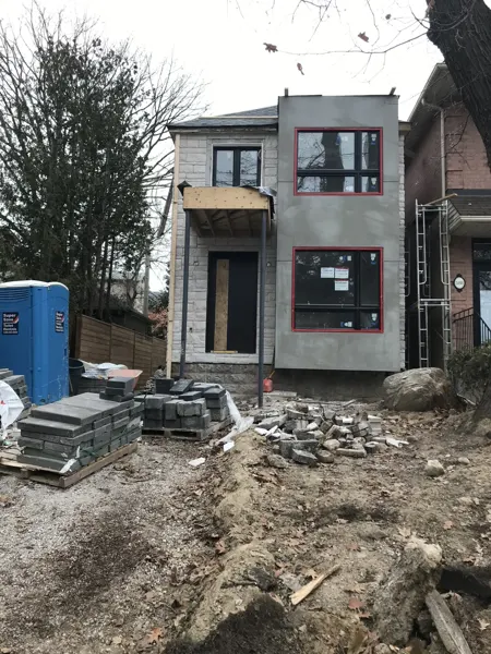 Front exterior — wall finish and entrance under construction