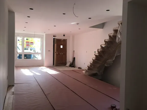 Main floor — protected flooring during finish work