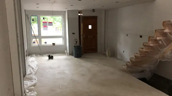 Main floor — drywall around the entrance and staircase