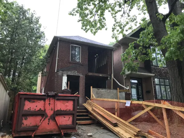 Front exterior — original porch and facade opened up