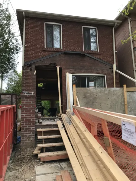 Front exterior — porch demolition and structural work