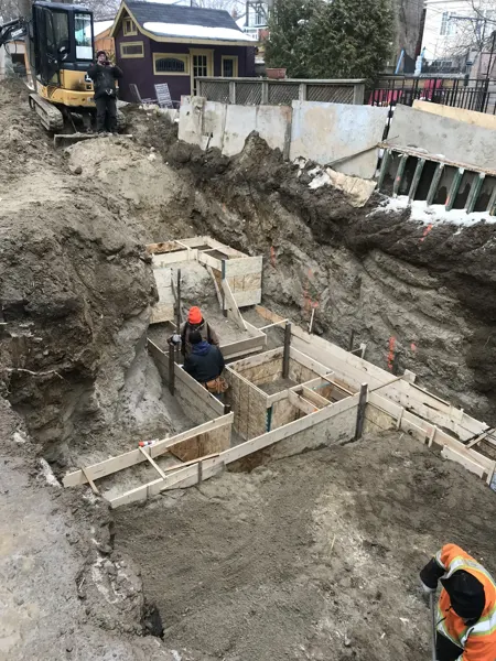 Rear addition — foundation formwork within the excavation