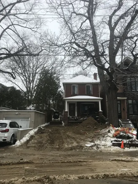Front exterior — original facade during site preparation