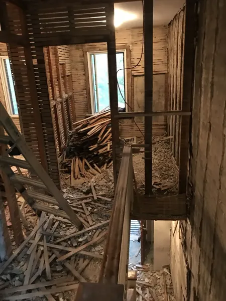 Interior — original wall linings stripped around the stairwell