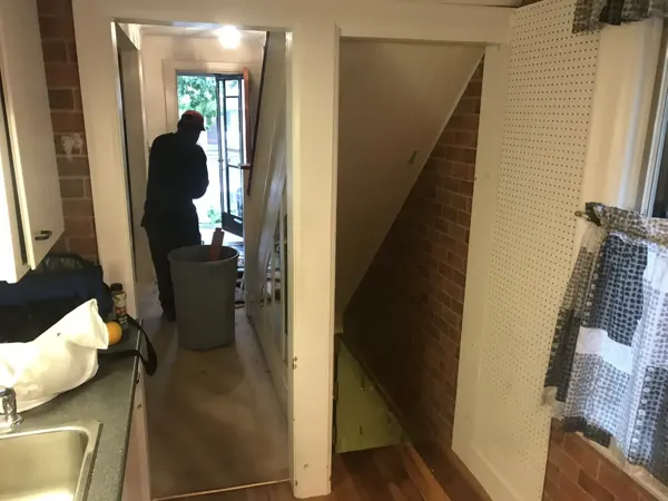 Before — existing kitchen beside the original staircase
