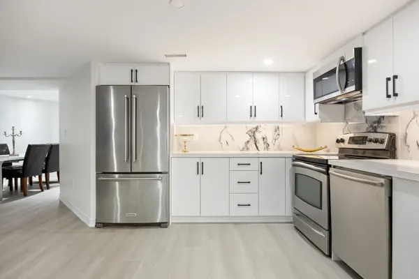 Completed basement kitchen cabinetry and appliances