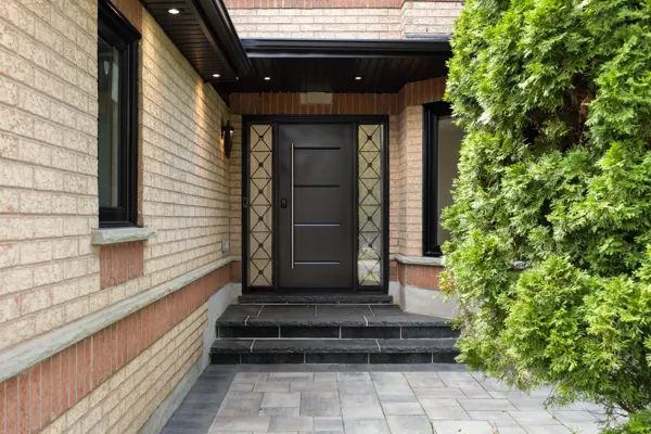 Completed front entrance and dark double doors