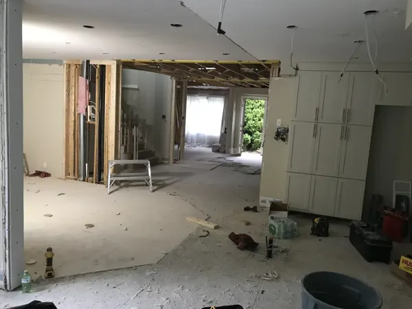 Kitchen and adjoining hallway during opening and ceiling work