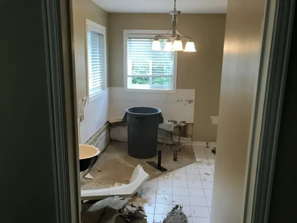 Bathroom stripping and preparation beside the two windows