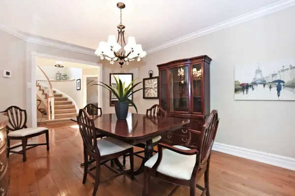 Original furnished dining room beside the foyer