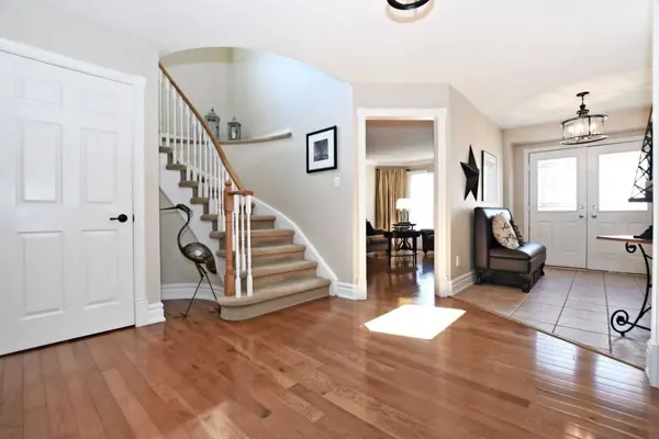Original staged foyer and curved staircase