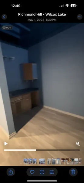 Existing blue-walled kitchenette and counter