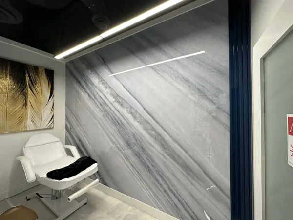 Finished treatment room with veined wall panel