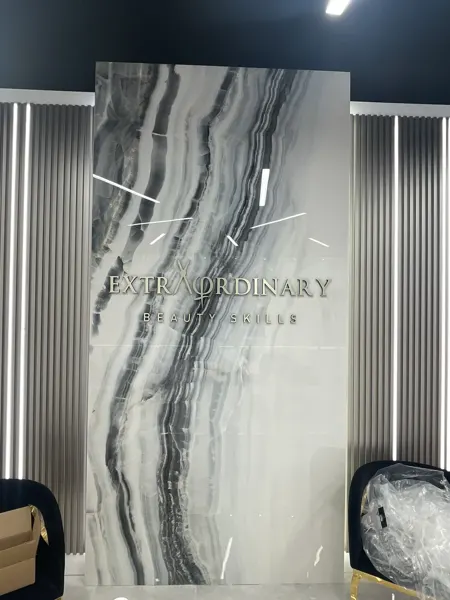 Completed salon signage and feature-wall detail