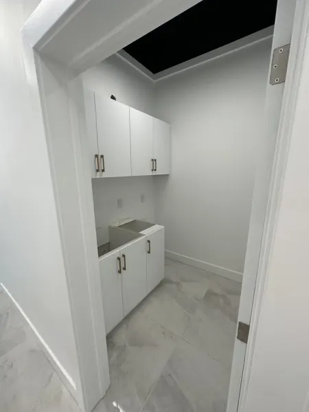 Kitchenette cabinets fitted before countertop and sink installation