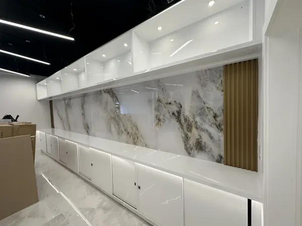 Service cabinetry and wall finish before mirrors and final fittings