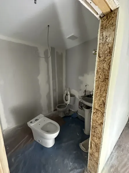 Washroom rebuilding with fixtures moved aside