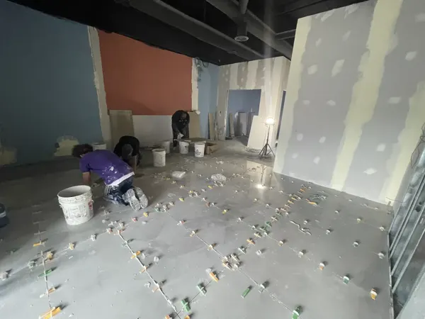 Floor tile installation in progress