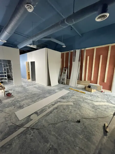 Partition board installation under the original exposed ceiling