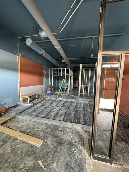 New metal partition framing beside the entrance