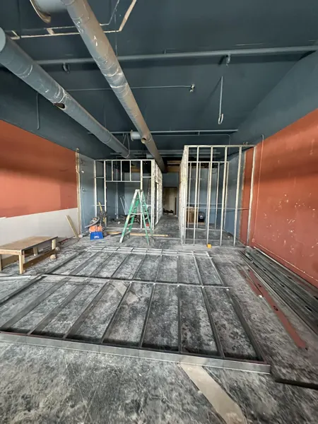 Metal framing across the former open room