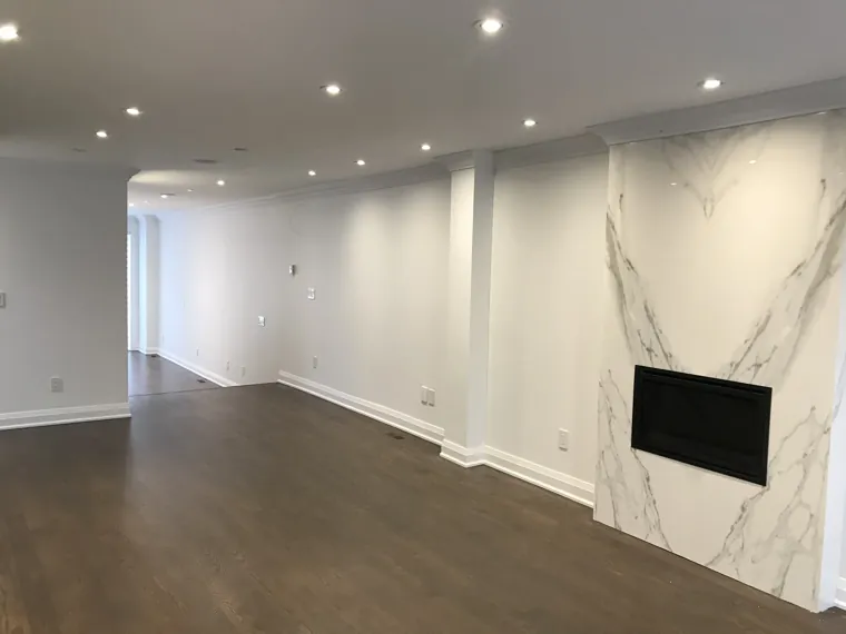 Completed living room — fireplace and timber flooring