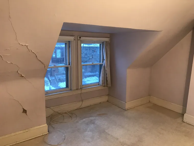 Original room beneath the sloped ceiling