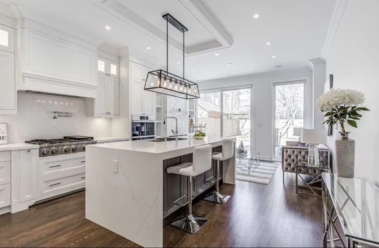 Completed kitchen — island seating toward the rear doors