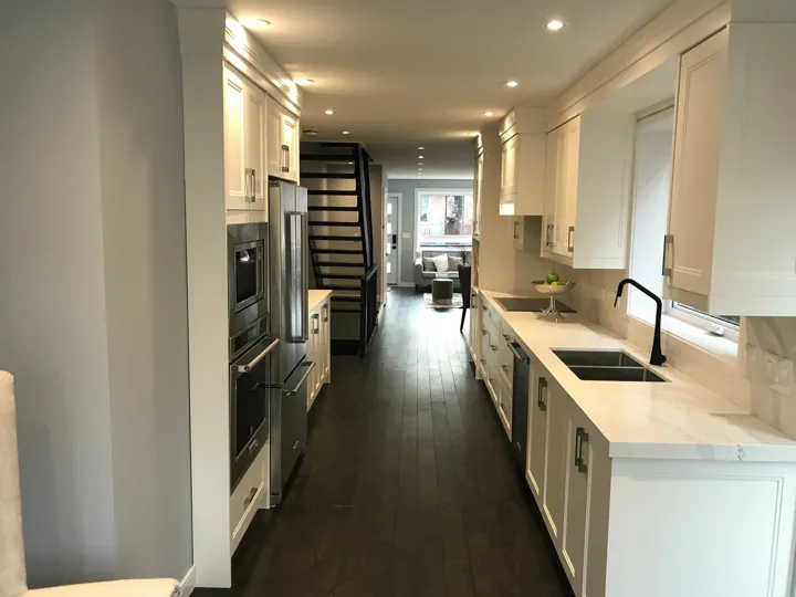 Finished galley kitchen looking toward the living room