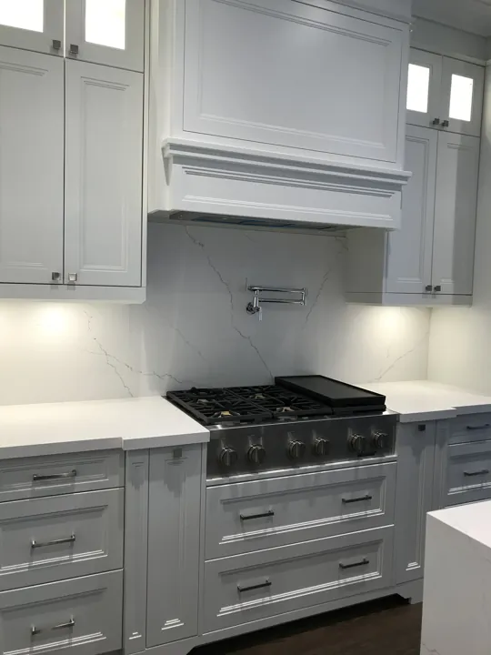 Completed kitchen — cooktop and cabinet detail