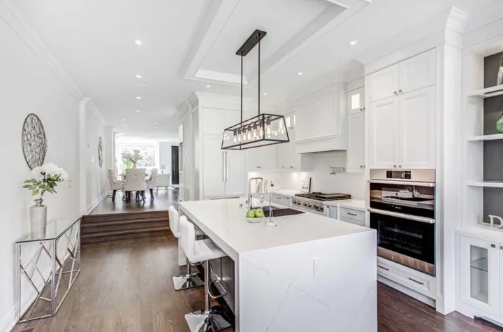 Completed kitchen — island, ovens and raised dining area