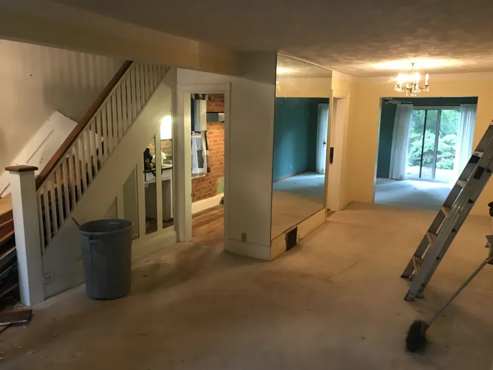 Before — original staircase and divided main floor