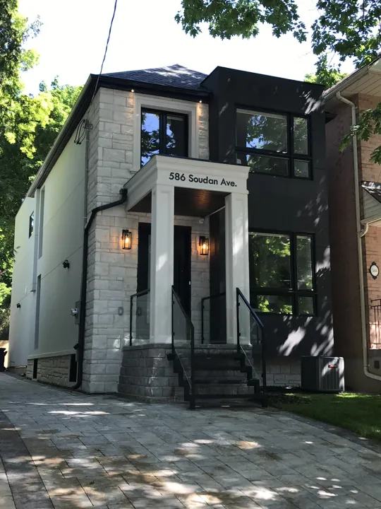 Completed front exterior — driveway approach